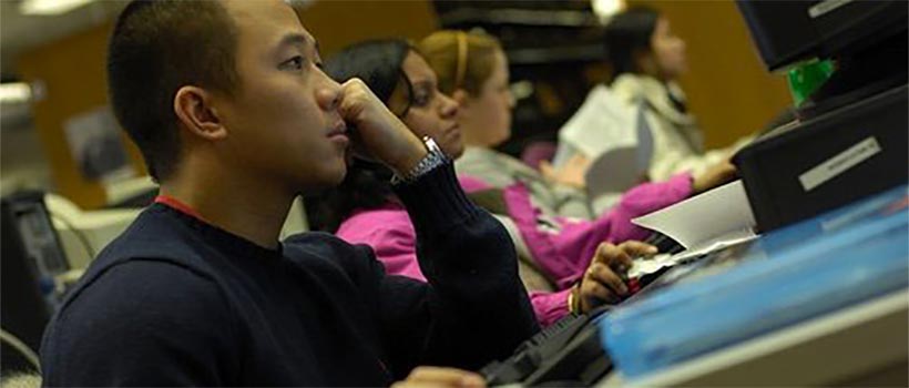 Students looking at computers