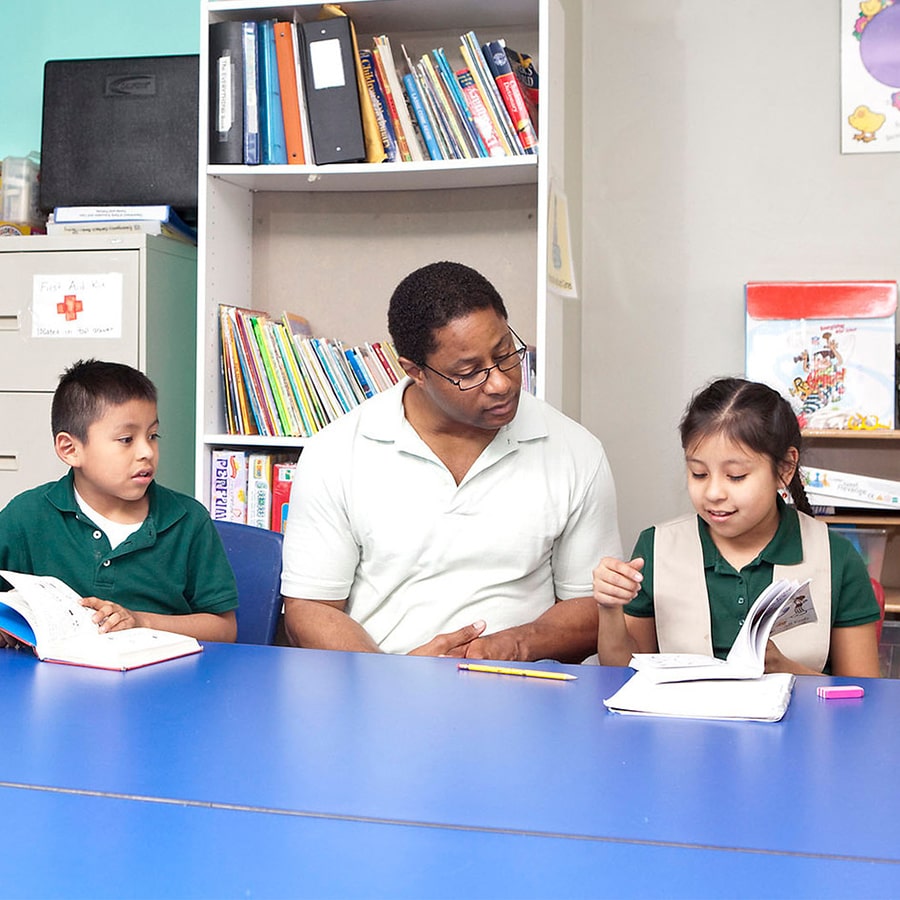 Student works with students in an afterschool tutoring program.