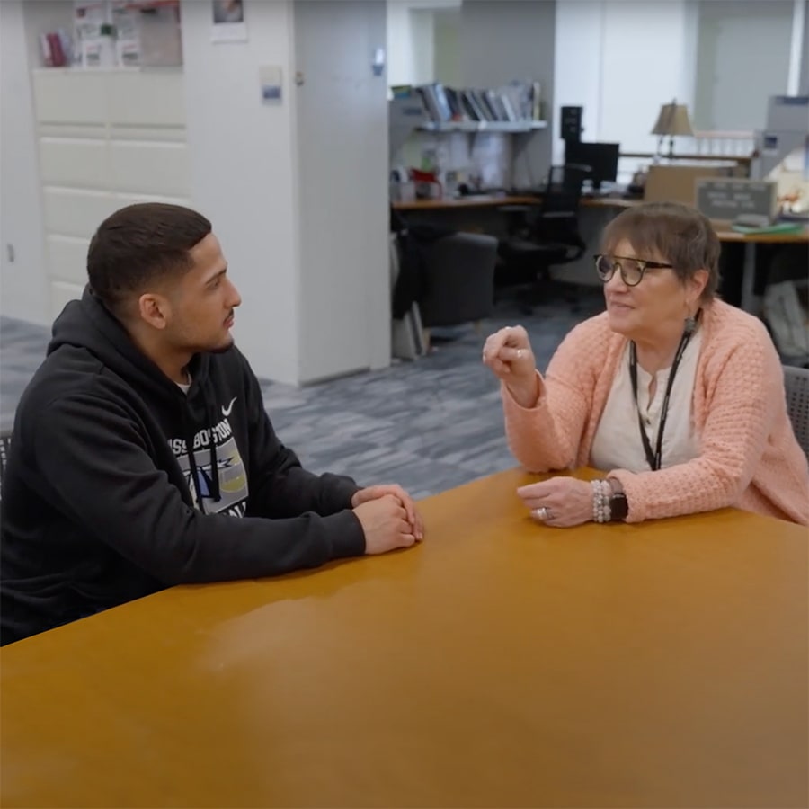 advising consultant with student at table