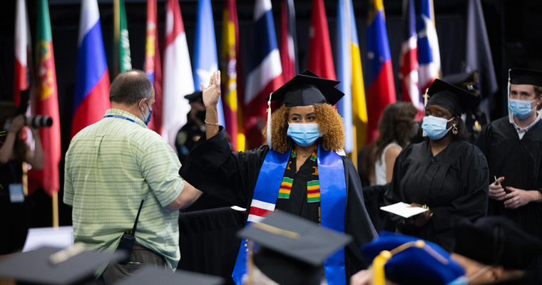 Student graduating during 2021 commencement 