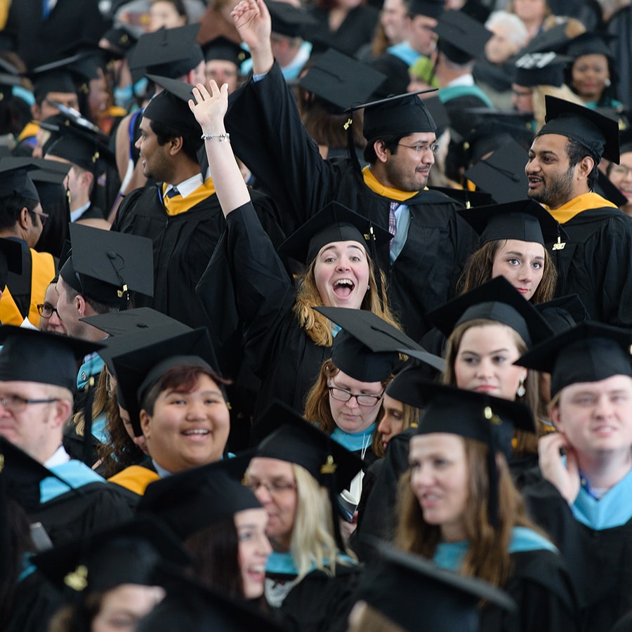 commencement photo of graduates in cap and gown