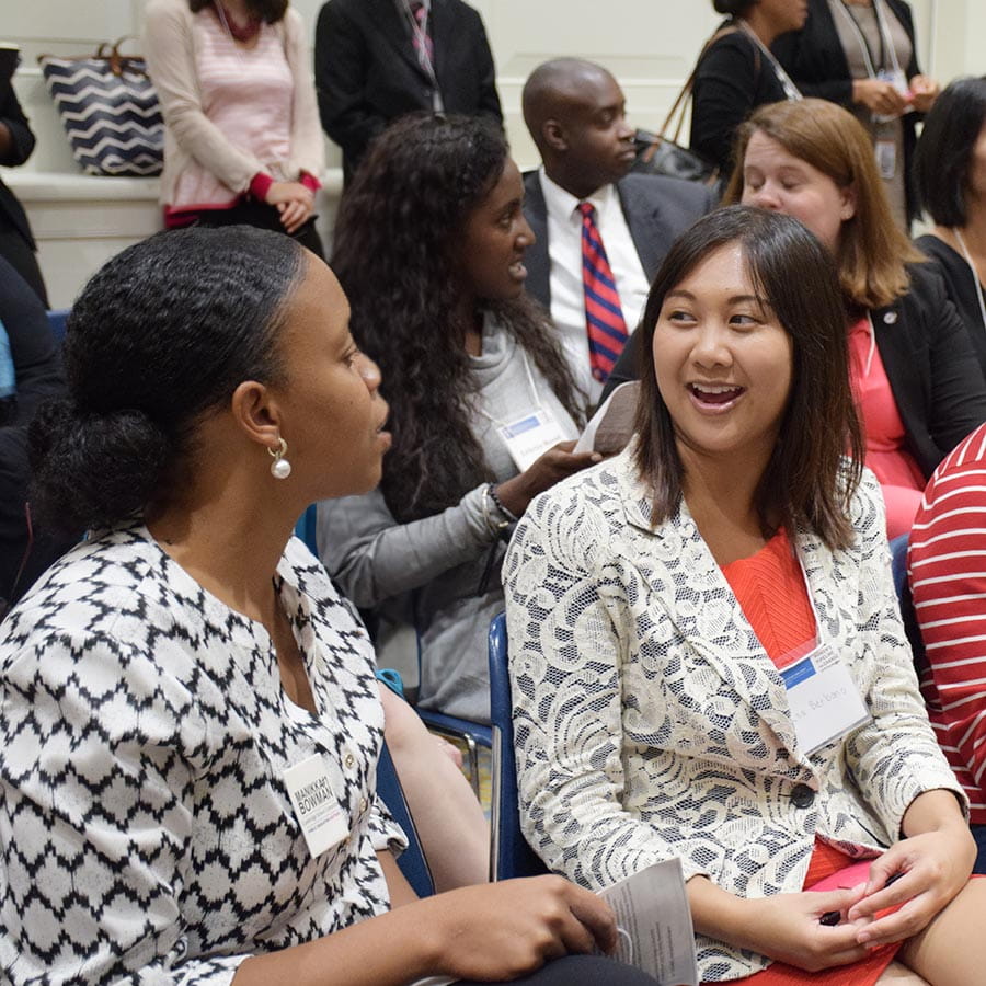 women having friendly chat at conference