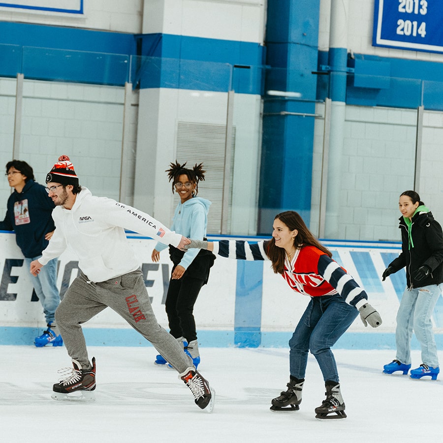 students skate on UMass Boston ice rink