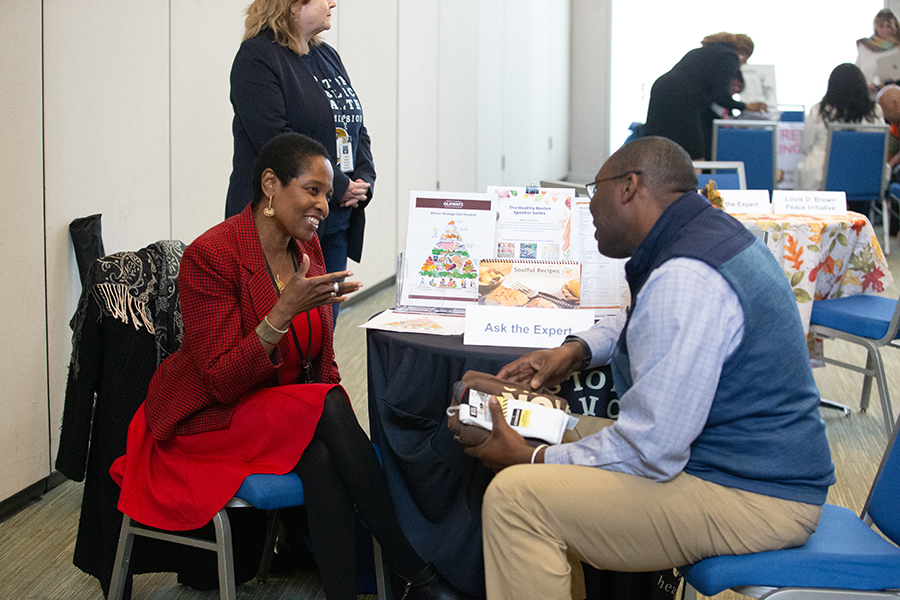 People interact at the BLM Day health fair