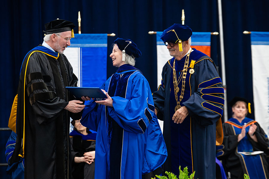Martha Minow, a 2026 honorary degree recipient, onstage with Provost Berger and Chancellor Suárez-Orozco.